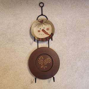 Iron wall hanger with snowman and folk art resin plates